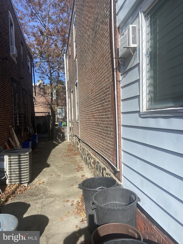 view of property exterior with central AC unit