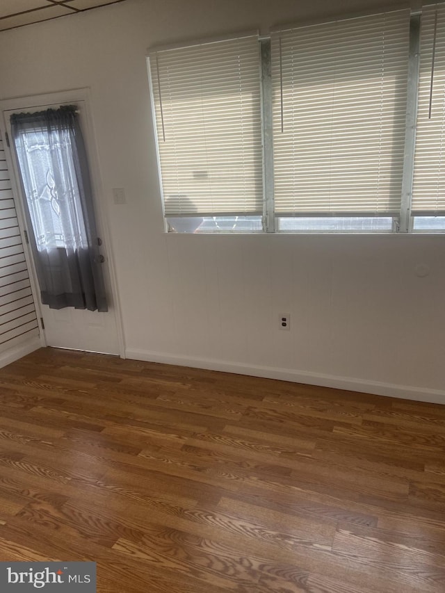 spare room with hardwood / wood-style floors