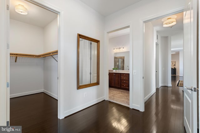 hallway with dark hardwood / wood-style floors