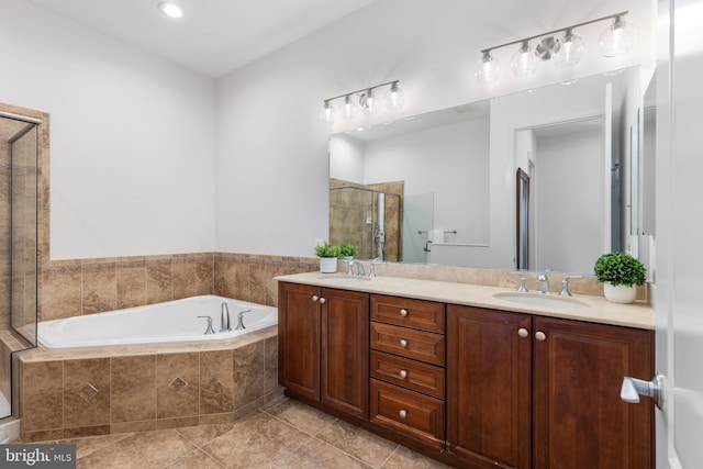 bathroom with tile patterned flooring, vanity, and separate shower and tub