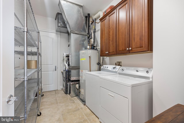 clothes washing area featuring cabinets, independent washer and dryer, light tile patterned flooring, and water heater