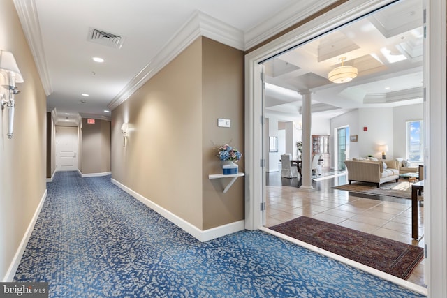 hallway featuring beamed ceiling, ornamental molding, and coffered ceiling