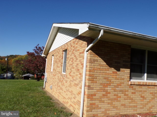 view of home's exterior with a lawn