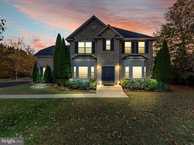 view of front of home with a lawn