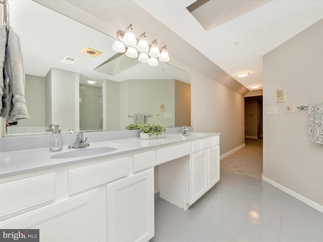 bathroom featuring tile patterned floors, vanity, and a shower with door