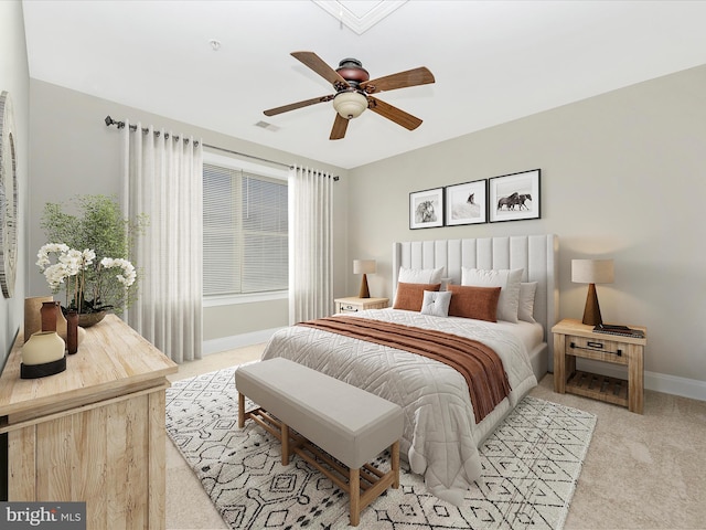 bedroom featuring light carpet and ceiling fan