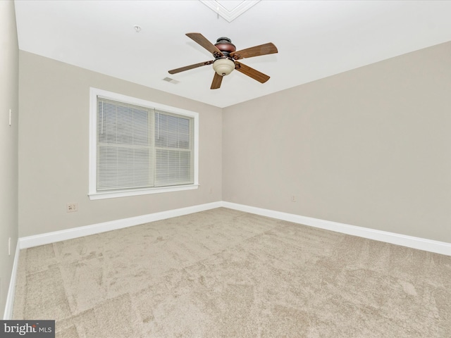 unfurnished room featuring light colored carpet