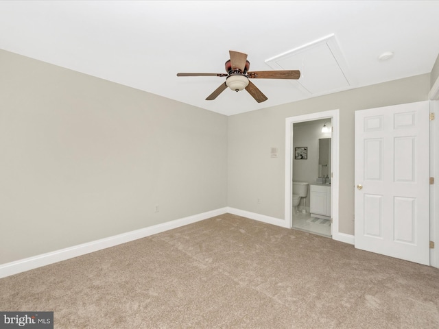 unfurnished bedroom with carpet flooring, ensuite bath, and ceiling fan