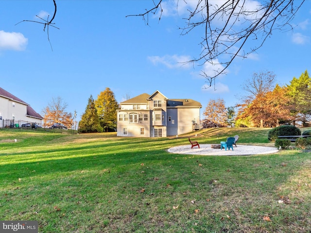 view of yard featuring a patio and an outdoor fire pit