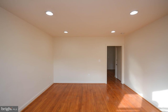 unfurnished room featuring light wood-type flooring