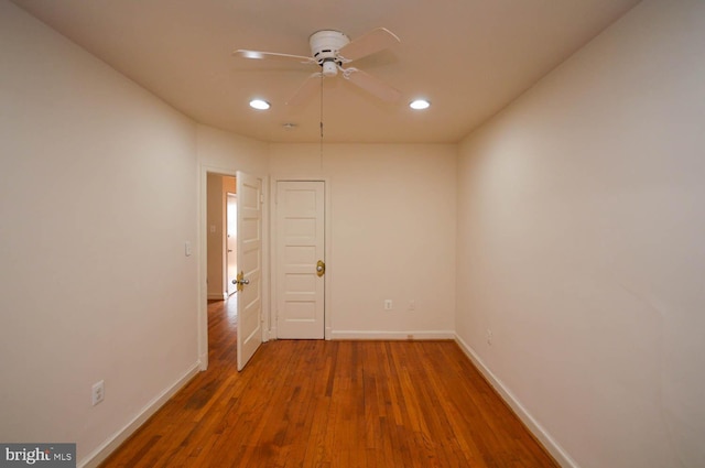 empty room featuring ceiling fan and wood-type flooring