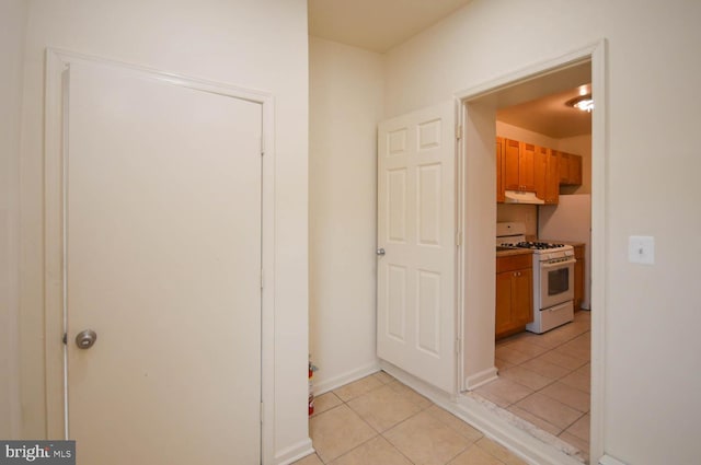 hallway featuring light tile patterned flooring