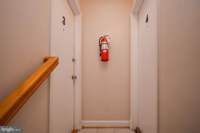 hallway with light tile patterned floors