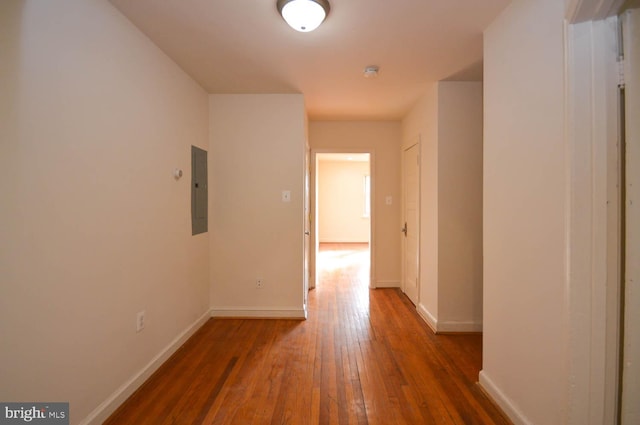 hallway with electric panel and dark hardwood / wood-style flooring