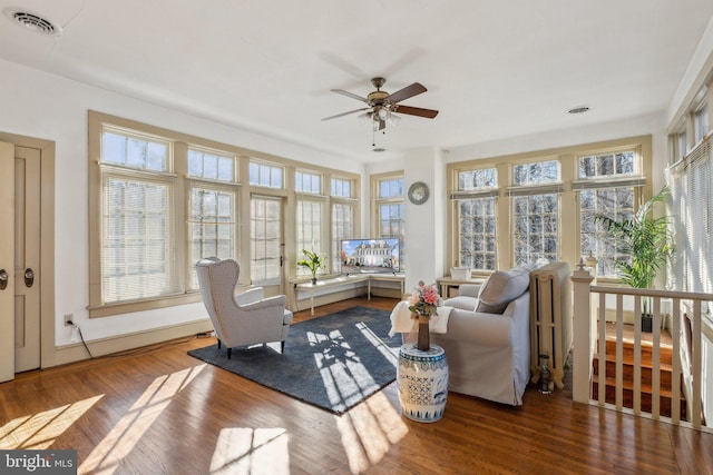 sunroom / solarium with ceiling fan