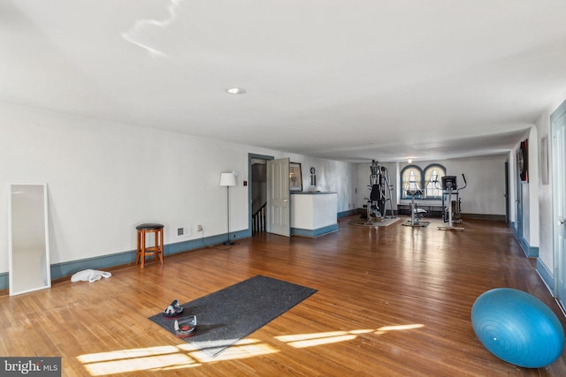 workout area featuring plenty of natural light and hardwood / wood-style flooring