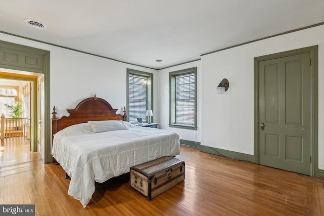 bedroom with light hardwood / wood-style flooring