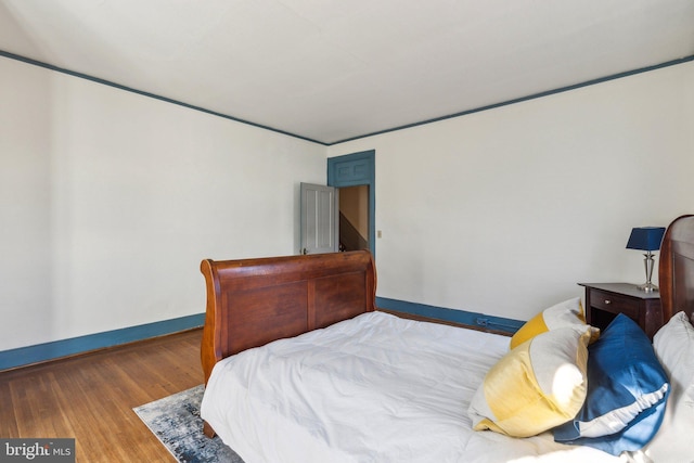 bedroom with hardwood / wood-style floors