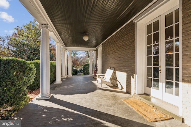 view of patio / terrace with french doors and a porch