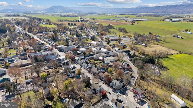 birds eye view of property with a mountain view