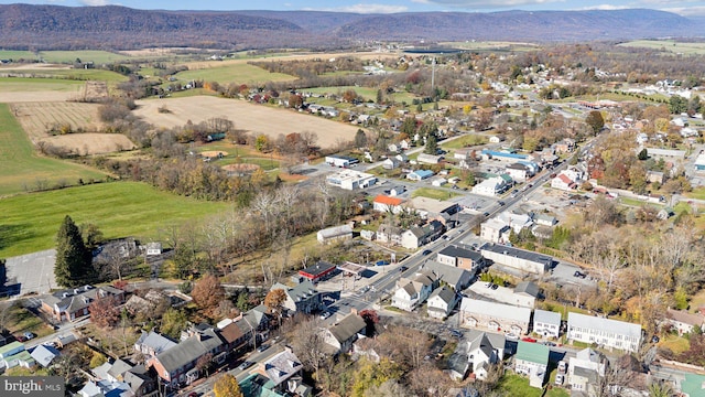 birds eye view of property with a mountain view