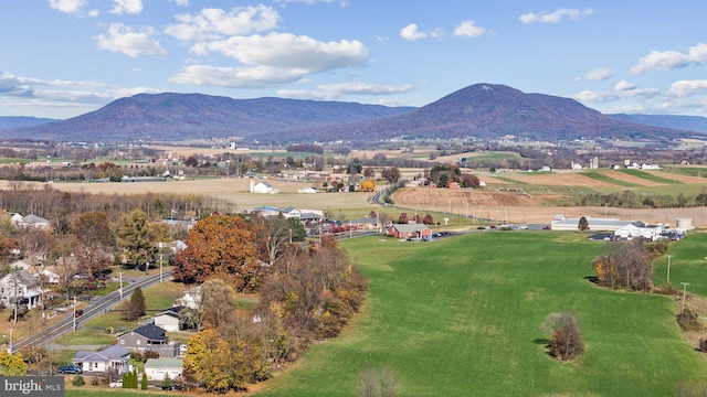 drone / aerial view with a mountain view and a rural view