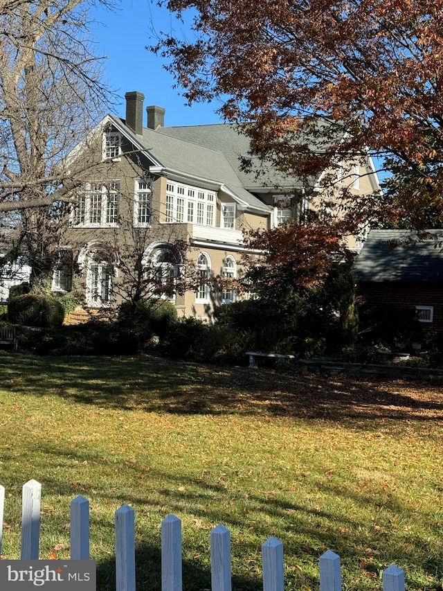 view of home's exterior with a yard