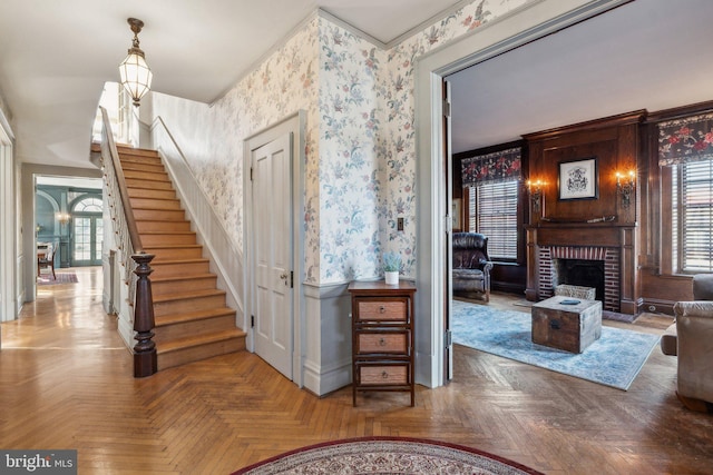 interior space with a fireplace and parquet floors