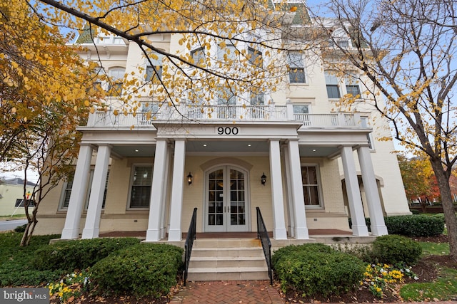 view of front of house with a balcony and a porch