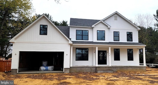 modern farmhouse featuring a shingled roof, covered porch, and an attached garage