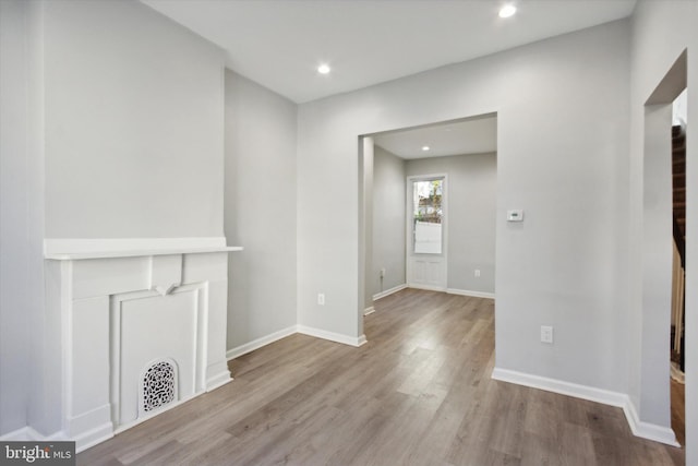 unfurnished living room with light hardwood / wood-style floors