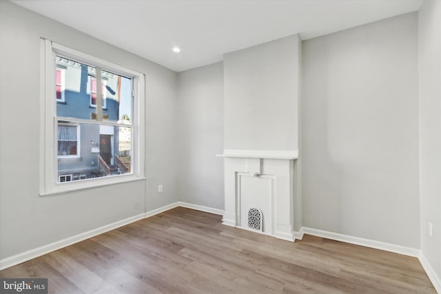 spare room featuring light wood-type flooring