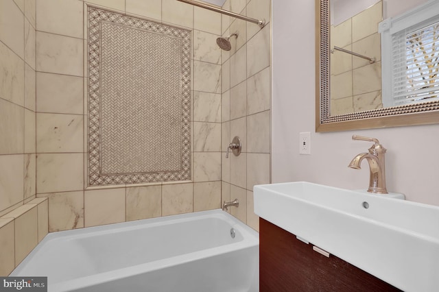 bathroom with vanity and tiled shower / bath combo