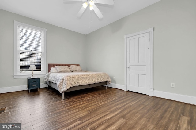 bedroom featuring dark hardwood / wood-style flooring and ceiling fan