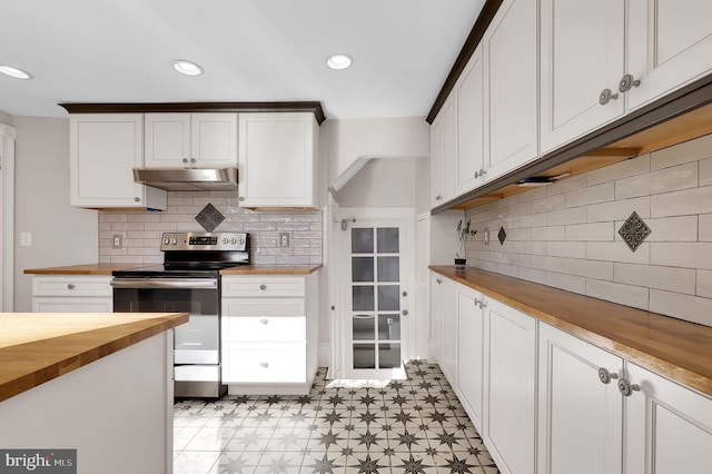 kitchen featuring white cabinets, wood counters, electric stove, and tasteful backsplash