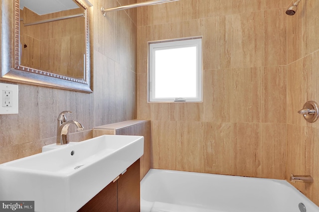 bathroom featuring vanity and shower / bathtub combination