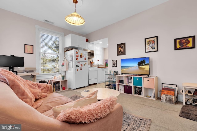 living room with light colored carpet