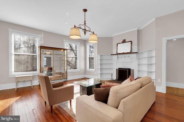 living room featuring a fireplace and dark hardwood / wood-style floors