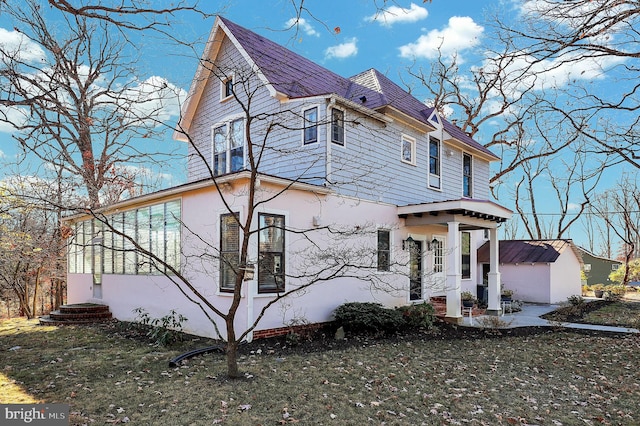 exterior space featuring a front lawn