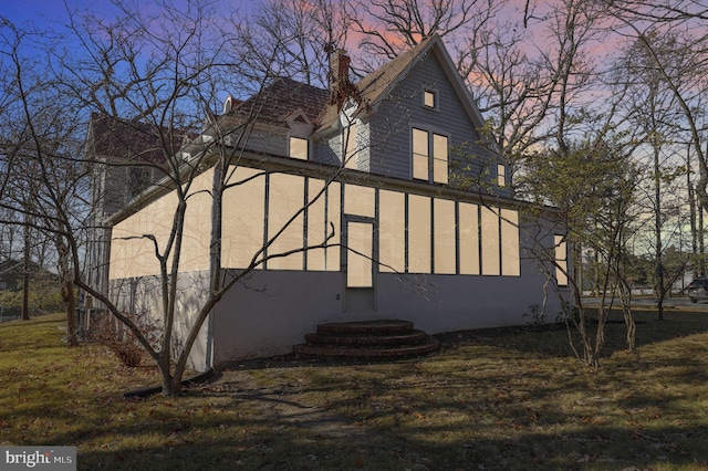 view of property exterior at dusk