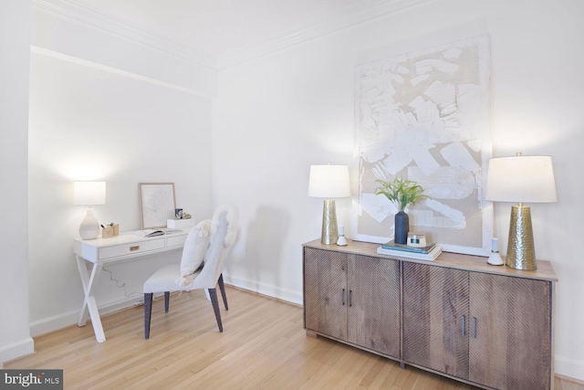 office featuring ornamental molding, wood finished floors, and baseboards