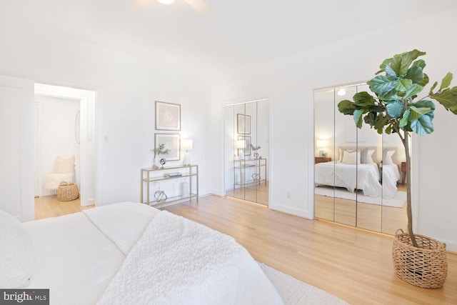 bedroom with baseboards and wood finished floors