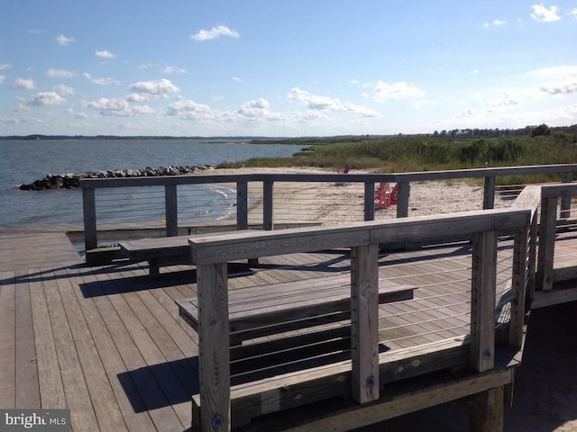 dock area with a deck with water view