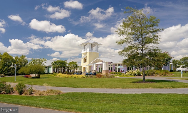 view of home's community with a yard