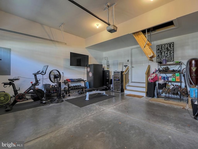 garage featuring electric panel and a garage door opener