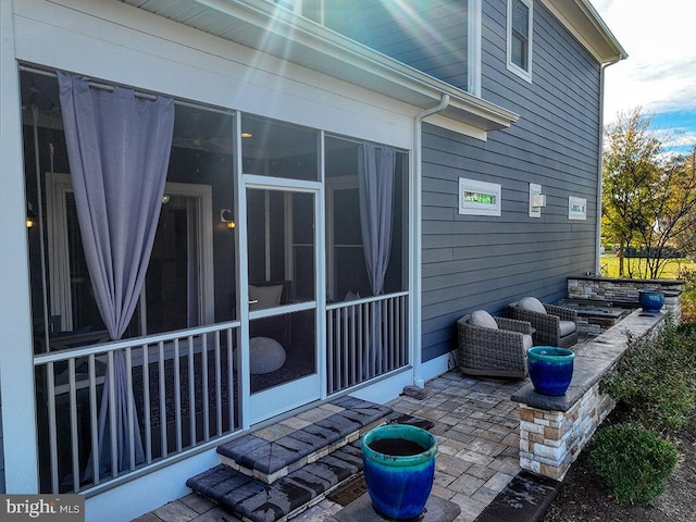 view of patio / terrace with a sunroom