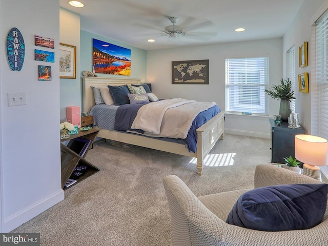 bedroom with light colored carpet and ceiling fan