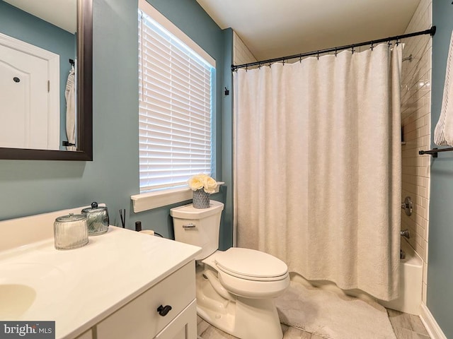 full bathroom featuring tile patterned flooring, vanity, toilet, and shower / bathtub combination with curtain