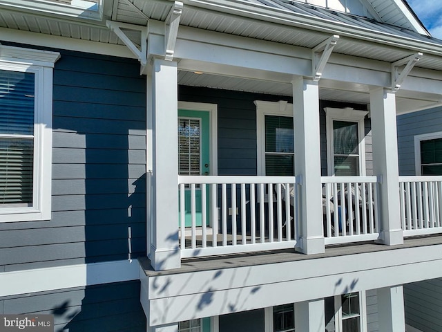 view of side of property with a porch