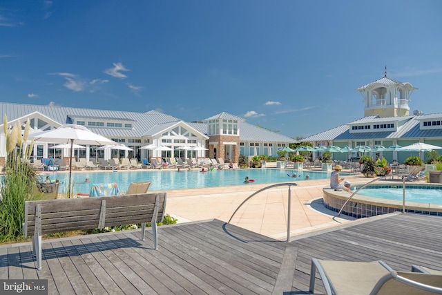 view of swimming pool featuring a wooden deck